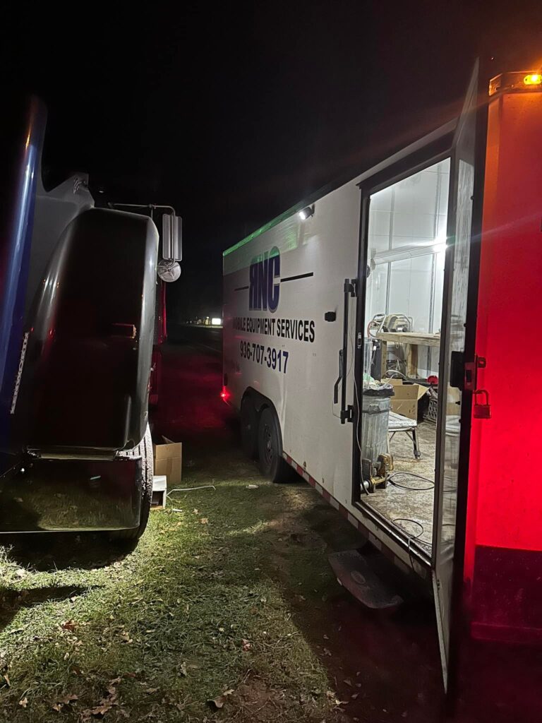 Mobile mechanic service trailer setup at night in East Texas